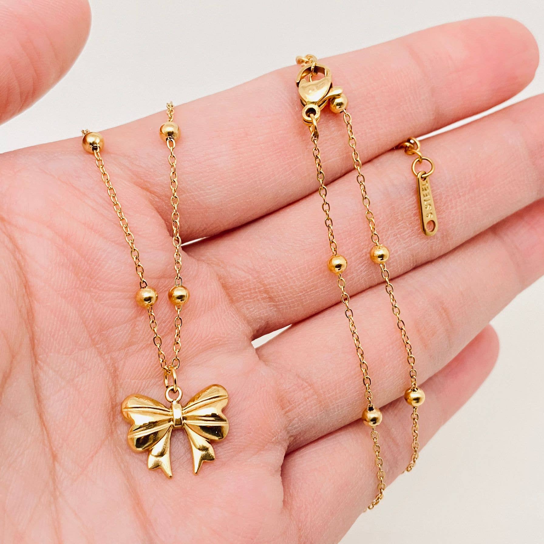 Darla-Gold Plated Stainless Steel Bow Pendant Necklace