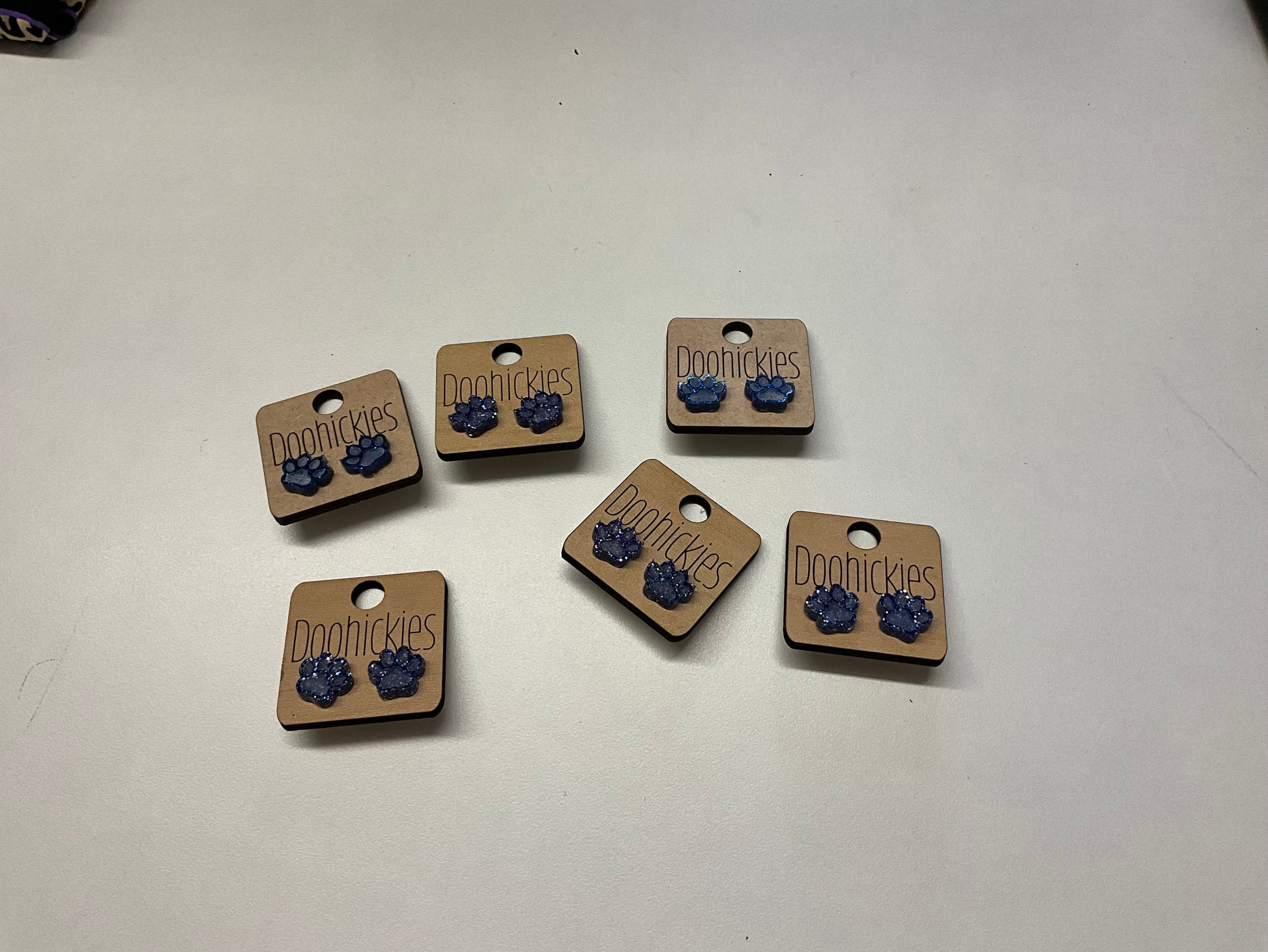Blue paw studs
