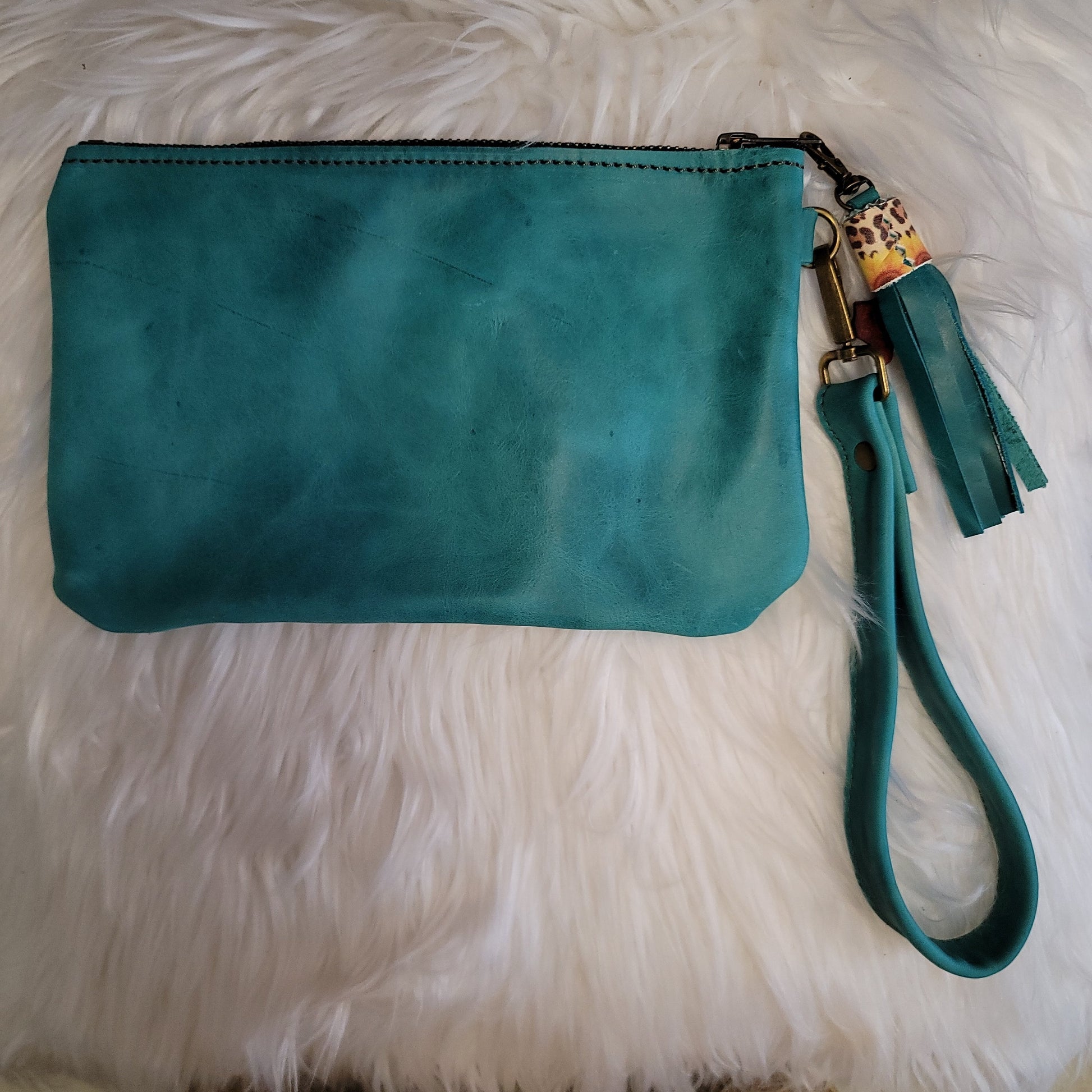 Turquoise wristlet with sunflowers