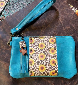 Turquoise wristlet with sunflowers